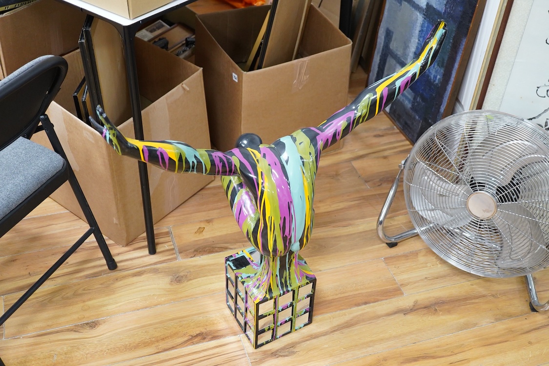 A large contemporary multicoloured composition sculpture of a diver, with mirrored base, 81cm high